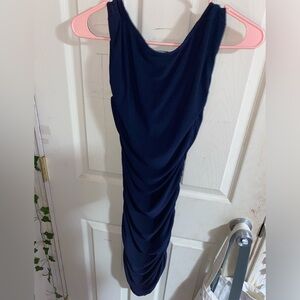 Dark blue dress with ruffles.